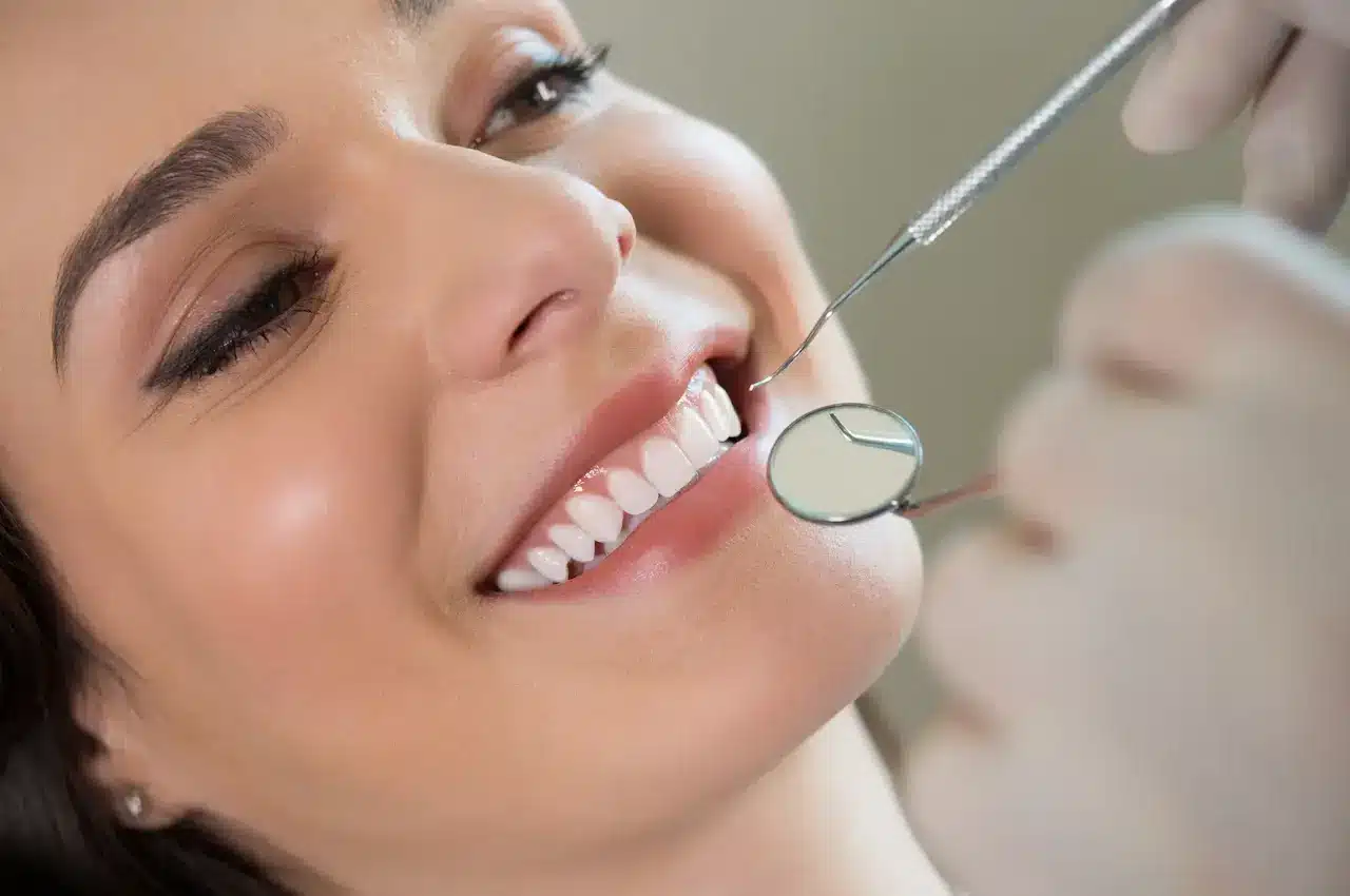 What is Tooth Whitening? Dentist Examining Woman's Teeth